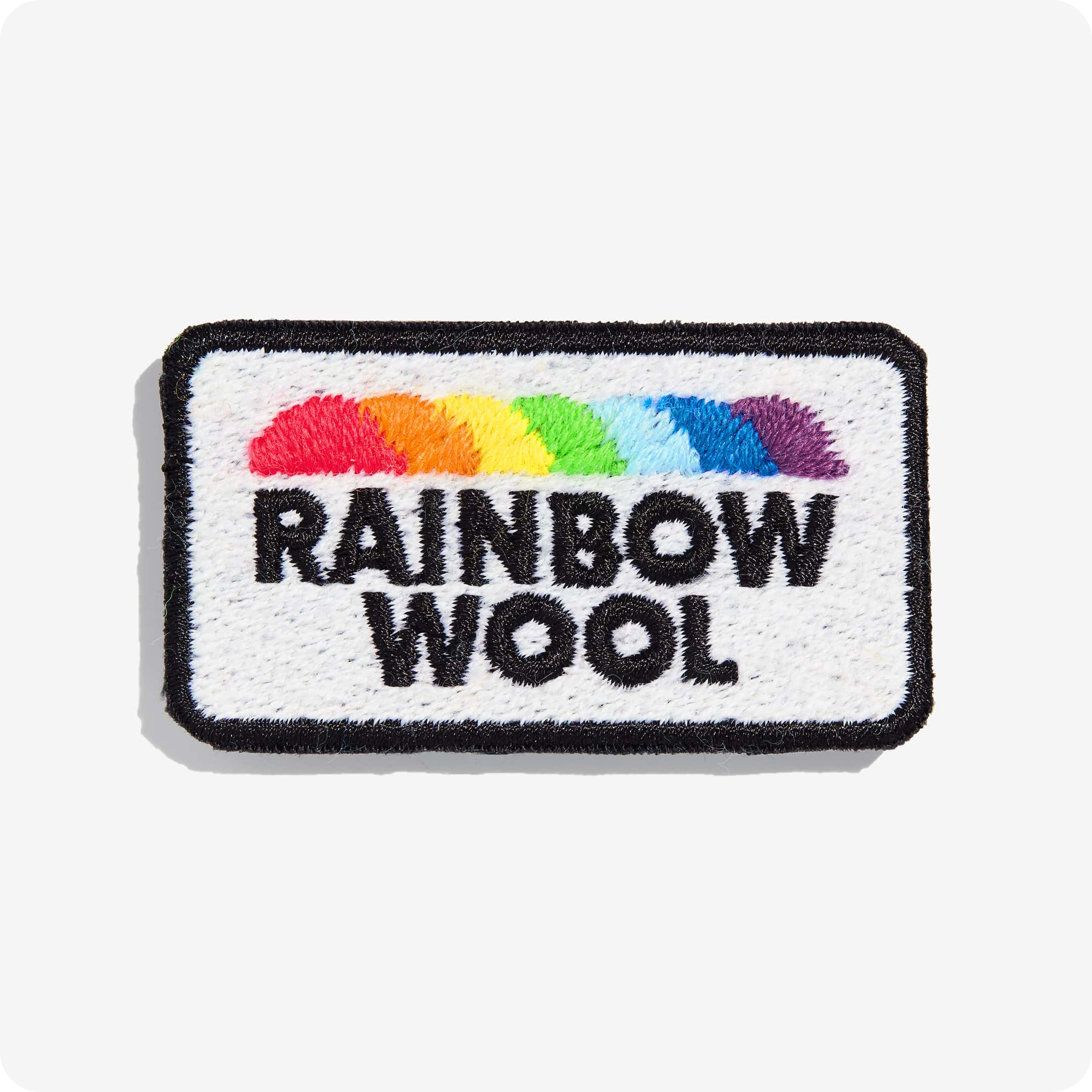 Patch "Rainbow Wool" made of gay sheep wool on a white background.